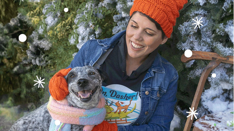 Person in BFAS sweatshirt petting a dog