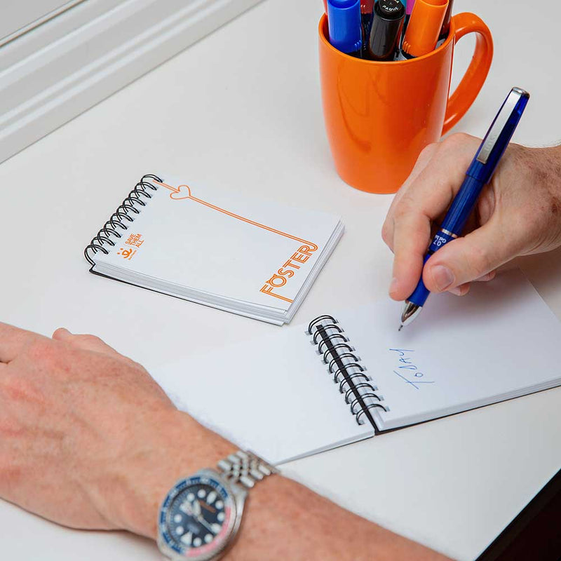 Writing in a Best Friends Animal Society notepad