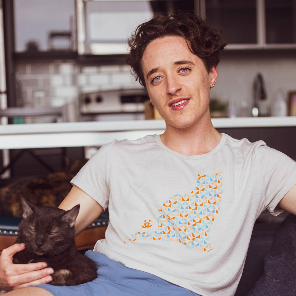 Person sitting in a cat T-shirt with a cat